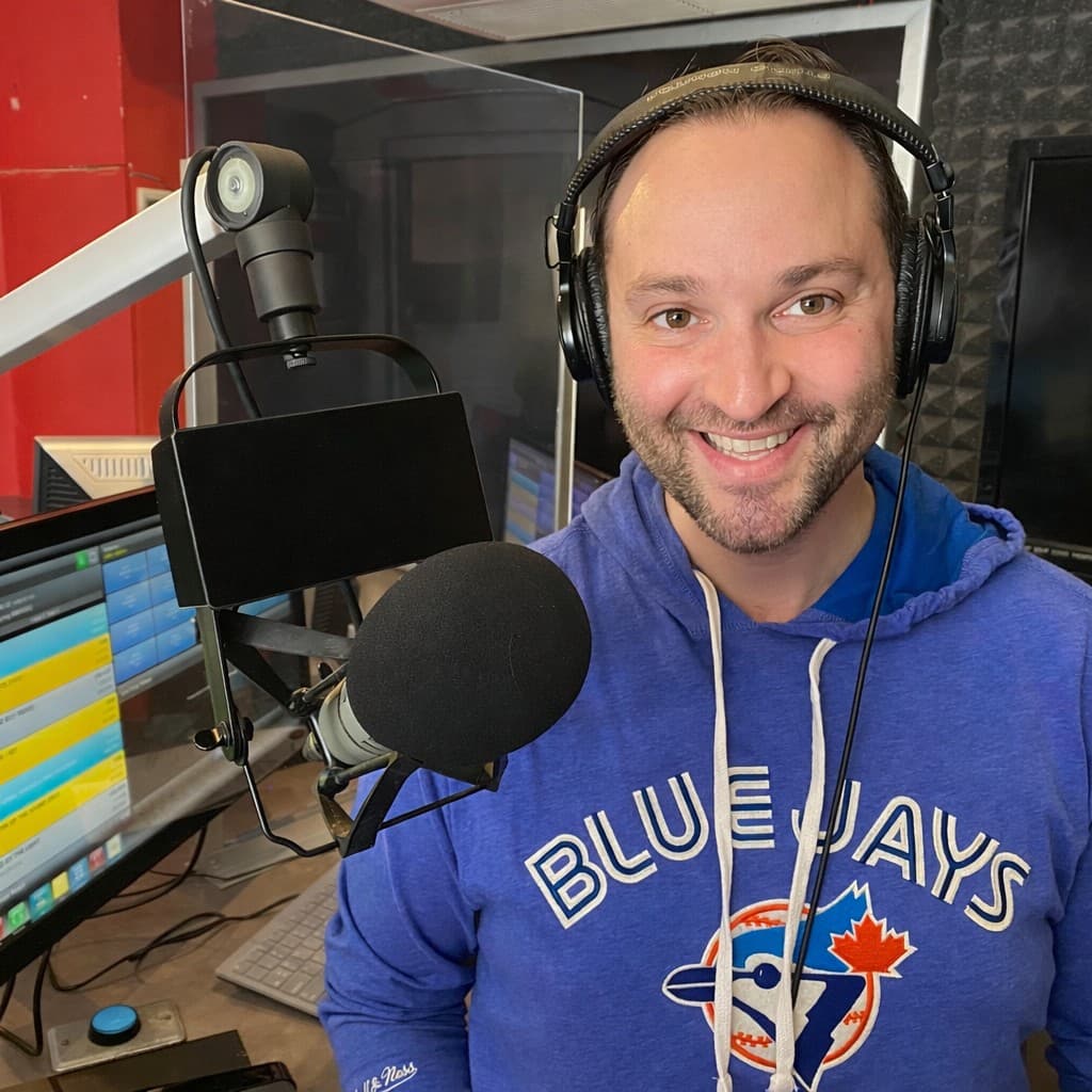 Rob Daniels in a professional radio studio with microphone and headphones, ready for voice over recording